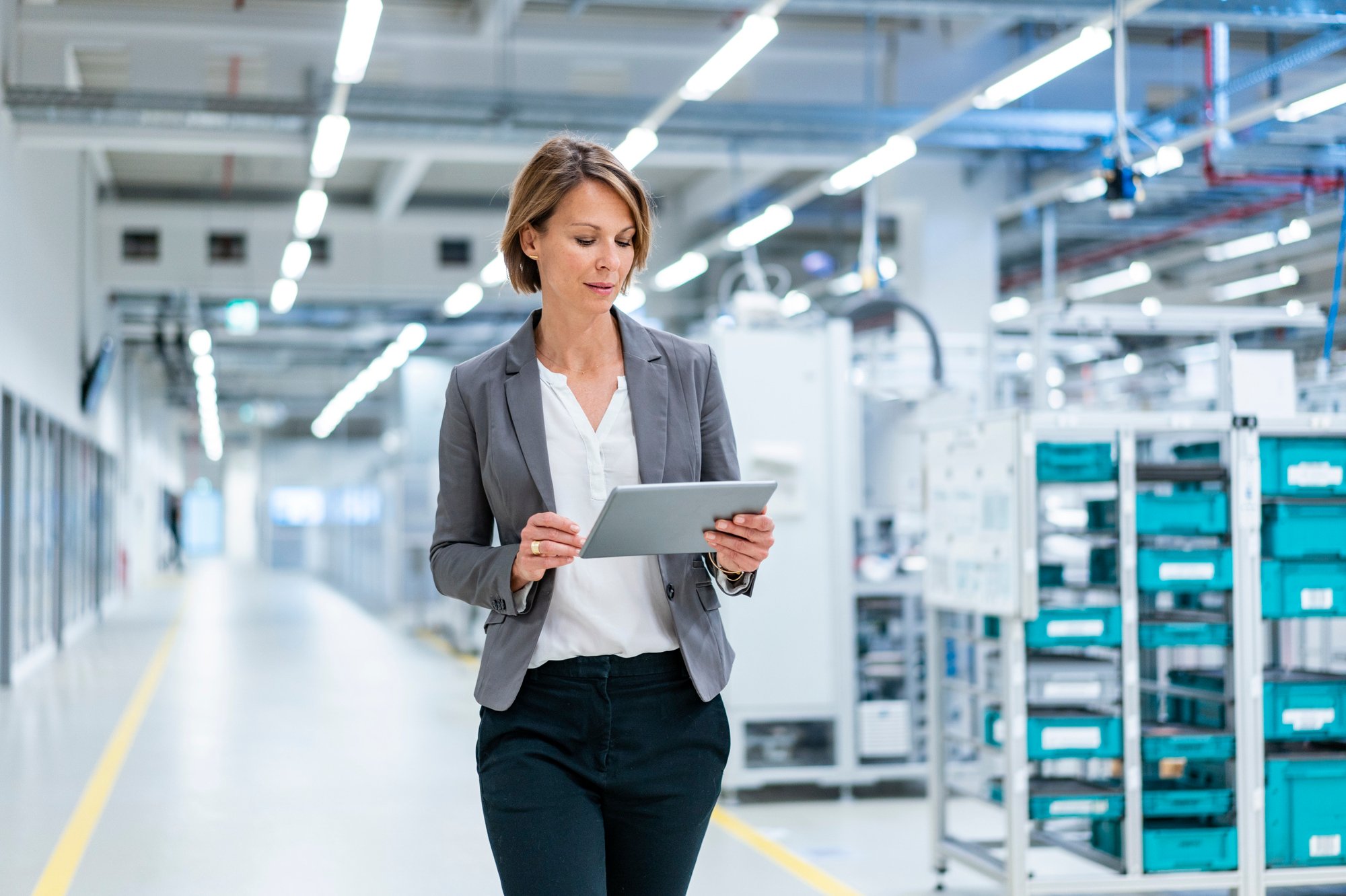 Header_Image-Picture-Business-Woman-Walking-Through-Production-Site-20210819-GLO-EN