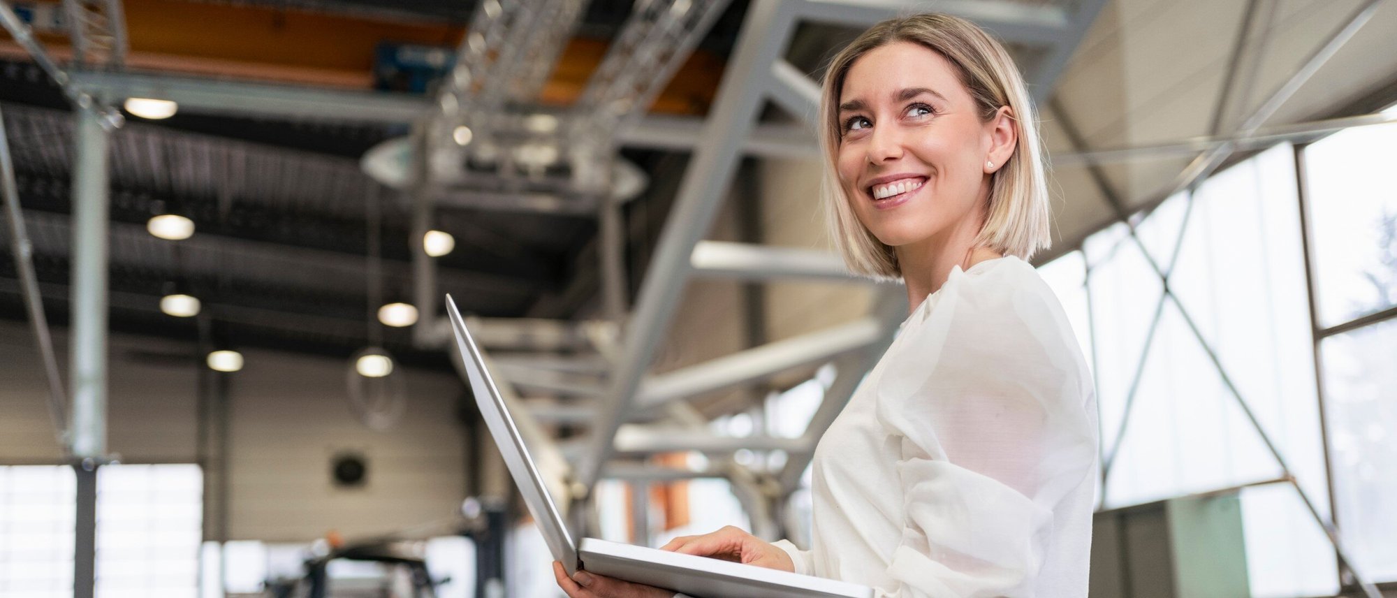 Header_Image-Picture-Woman-Works-with-Laptop-in-Factory-20210630-GLO-EN