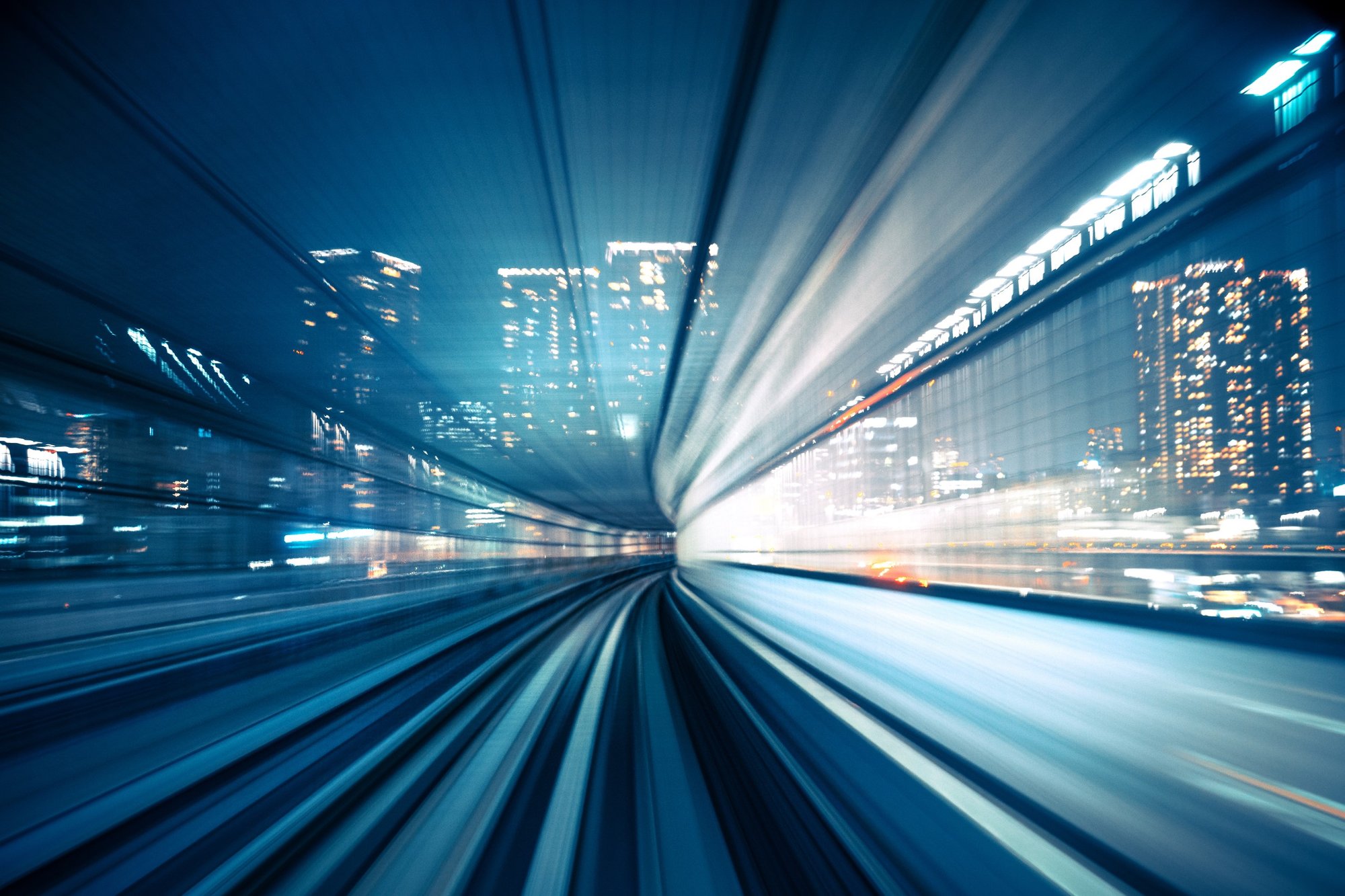 Web-PPT_City-skyline-at-night-motion-blur-of-train-moving-to-city-20231213-GLO-EN